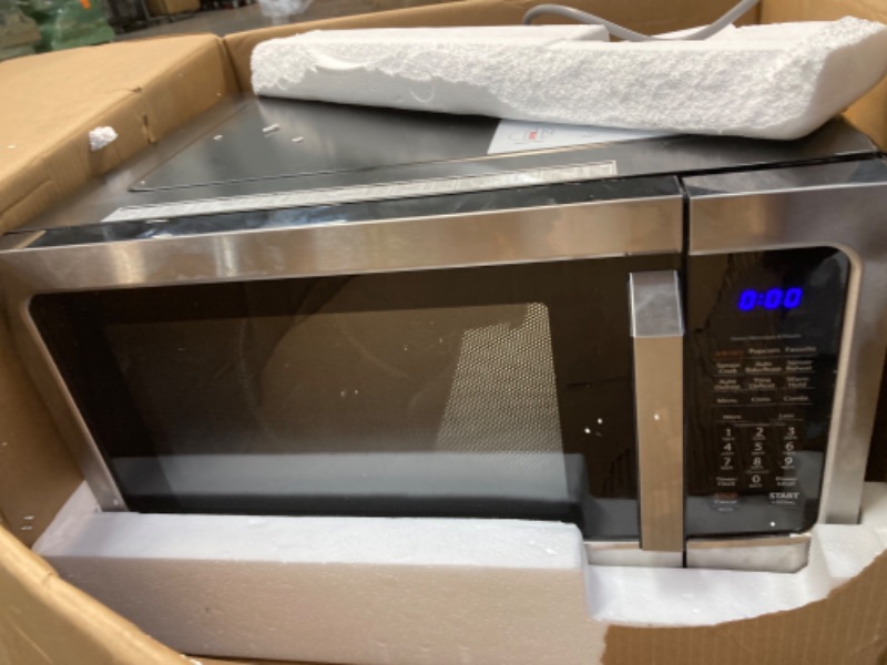 Photo 3 of ****HAS LARGE DENT ON TOP****Toshiba Air Fryer Combo 4-in-1 Countertop Microwave Oven, Smart Sensor, Convection, Mute Function, Position Memory 13.6" Turntable, 1.5 Cu Ft, 1000W, Silver, ML-EC42P(SS)