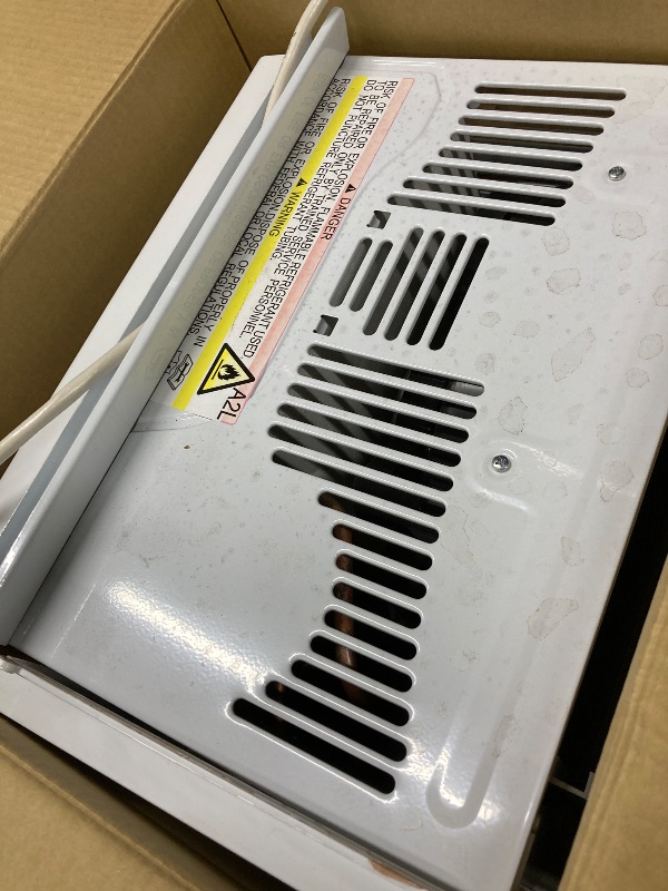 Photo 2 of ***PARTS ONLY***GE® 6,000 BTU Electronic Window Air Conditioner for Small Rooms up to 250 sq ft. ***(BOX RIPPED TORN, ITEM DIRTY.DUSTY, SOME PAINT TRANSFER,)*** 