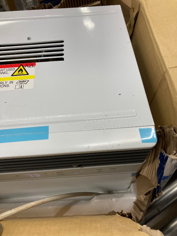 Photo 4 of ****DOES NOT WORK PROPERLY/TURNS OFF AT LOW TEMPERATURES****GE
8,000 BTU 115-Volt Smart Window Air Conditioner for 350 Sq. Ft. in White with Wi-Fi and Remote ***(DAMAGE AIR CONDITIONER RUNS BUT CUTS OFF AT LOWER TEMPERATURES  EXAMPLE 65 DEGREES, BOX RIPPE