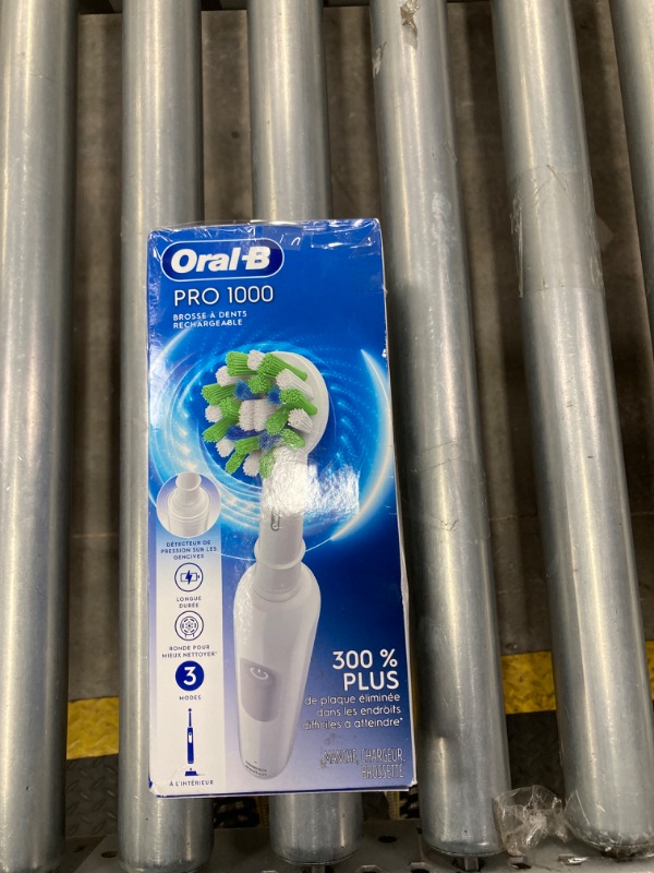 Photo 1 of Oral-B Pro 1000 Rechargeable Electric Toothbrush, White White 1 Count (Pack of 1)