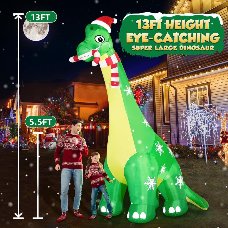 Photo 1 of 13FT Giant Dinosaur Christmas Inflatable Decorations, Built-in LED Lights, Strong Blower Huge Blow Up Yard Clearance Decor with Large Candy Cane Xmas Santa Hat Outdoor Indoor Holiday Party
