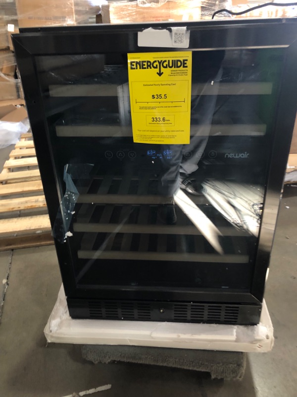 Photo 2 of ***USED - DAMAGED - COVERED IN DENTS - POWERS ON - UNABLE TO TEST FURTHER - NO PACKAGING - PARTS LIKELY MISSING***
NewAir 24" Wine Cooler, 46 Bottle Dual Zone Wine Refrigerator, Built-in Small Wine Fridge, Black Stainless Steel Mini Fridge with Reversible