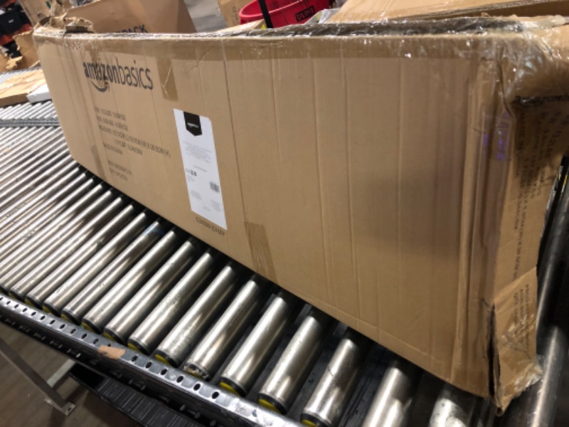 Photo 1 of Amazon Basics Full-Size Ironing Board - 4-Leg Fold-Up, Chevron Removable Cover, 60"L x 14"W x 38"H