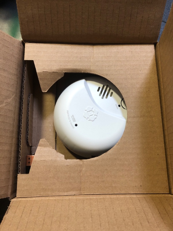 Photo 1 of First Alert SMICO100-AC Interconnect Hardwire Combination Smoke & Carbon Monoxide Alarm with Battery Backup, 1-Pack