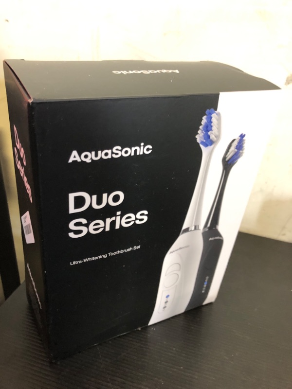 Photo 2 of Aquasonic Duo - Dual Handle Ultra Whitening 40,000 VPM Wireless Charging Electric ToothBrushes - 3 Modes with Smart Timers - 10 Dupont Brush Heads & 2 Travel Cases Included