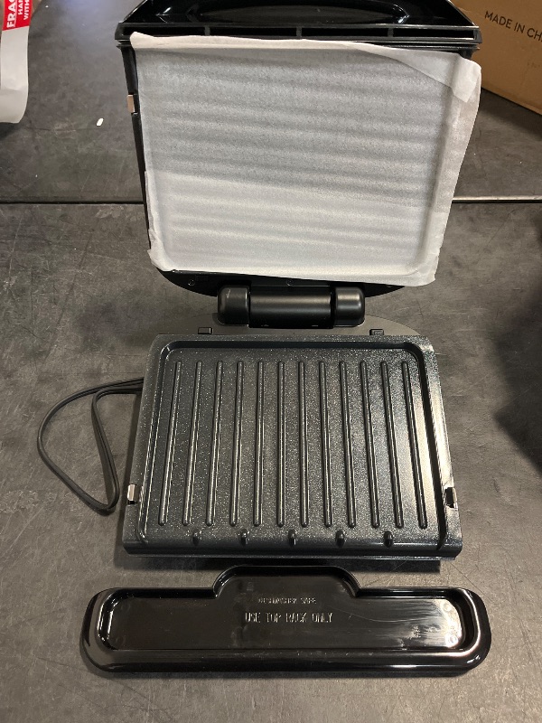 Photo 1 of George Foreman 4-Serving Removable Plate Electric Grill and Panini Press, George Tough Non-Stick Coating, Drip Tray Catches Grease, Black