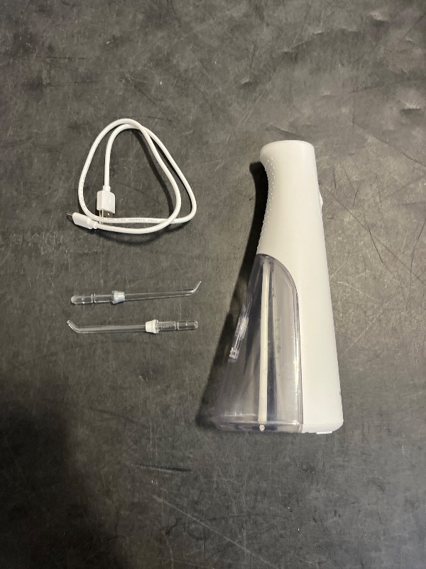 Photo 1 of Waterpik Cordless Pulse Rechargeable Portable Water Flosser for Teeth, Gums, Braces Care and Travel with 2 Flossing Tips, Waterproof, ADA Accepted, WF-20 White, Packaging May Vary
