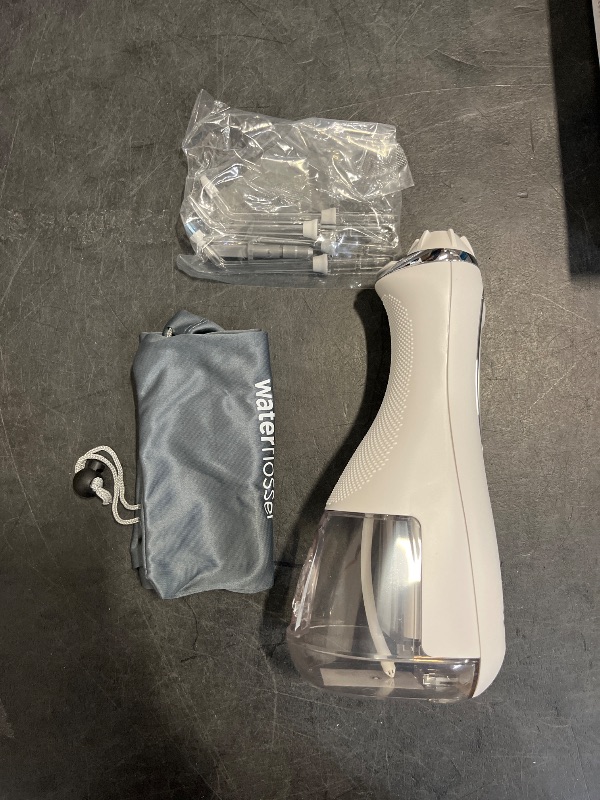 Photo 1 of Waterpik Cordless Advanced 2.0 Water Flosser For Teeth, Gums, Braces, Dental Care With Travel Bag and 4 Tips, ADA Accepted, Rechargeable, Portable, and Waterproof, White WP-580, Packaging May Vary