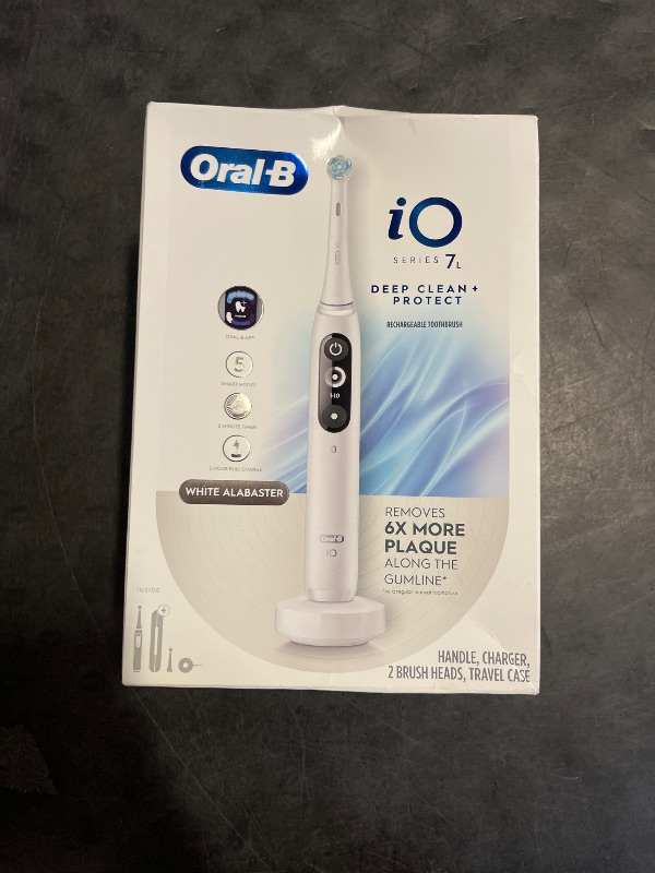Photo 1 of Oral-B iO Deep Clean + Protect Rechargeable Electric Toothbrush, White with a iO Series 7 Toothbrush, 2 Replacement Brush Heads, and a Charging Travel Case