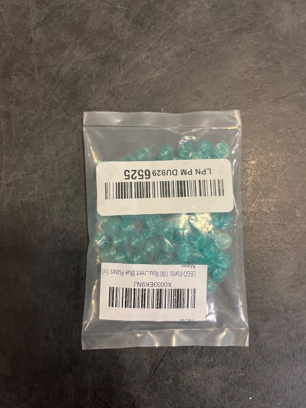 Photo 1 of LEGO Parts: 100 Round Transparent Blue Plates 1x1