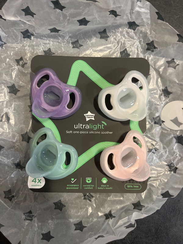 Photo 1 of Tommee Tippee Ultra-Light Silicone Pacifier, 0-6 Months, Symmetrical One-Piece Design, BPA-Free Silicone Binkies, Pink/Purple/Green, Pack of 4