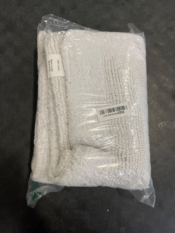 Photo 1 of Cotton Craft 2 Piece Reversible Step Out Bath Mat Rug Set 17x24 White, 100% Pure Cotton, Super Soft, Plush & Absorbent, Hand Tufted Heavy Weight Construction, Full Reversible, Rug Pad Recommended