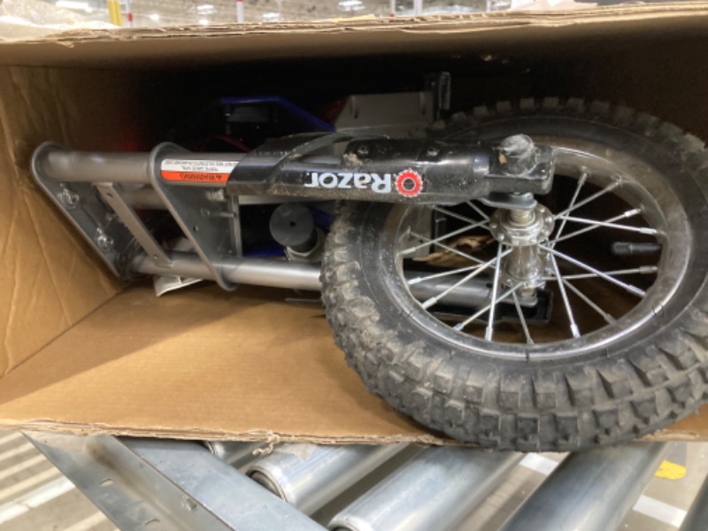 Photo 1 of Razor MX350 Dirt Rocket Electric Motocross Off-Road Bike for Age 13+, Up to 30 Minutes Continuous Ride Time, 12" Air-Filled Tires, Hand-Operated Rear Brake, Twist Grip Throttle, Chain-Driven Motor