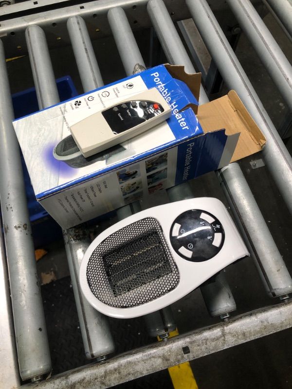 Photo 2 of ***tested, turn on this item need turn both switch and click the power button on the panel, no batteries in the remote*** Ecowarm Plug in Heater, 500W Wall Outlet Electric Space Heater as Seen on TV, Small Portable Space Heater with Adjustable Thermostat 