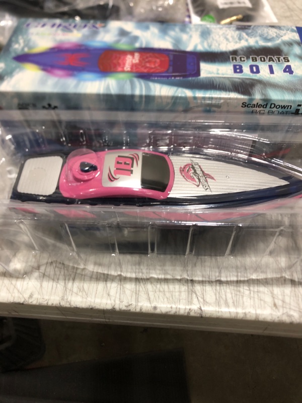 Photo 1 of RC Boat with LED Lights- 2.4GHz Remote Control Boat for Pool and Lakes, 360° Flip Stunt Racing Boats with 2 Modular Rechargeable Battery, Gifts for 8-12 Boys Girls Kids (Pink)