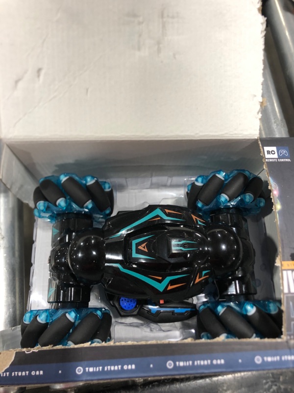 Photo 1 of 1:12 RC Stunt Car, 2.4GHz 4WD Remote Control Gesture Sensor Toy Cars, Double Sided Rotating Off Road Vehicle 360° Flips with Lights Music, Toy Cars for Boys & Girls Birthday Blue