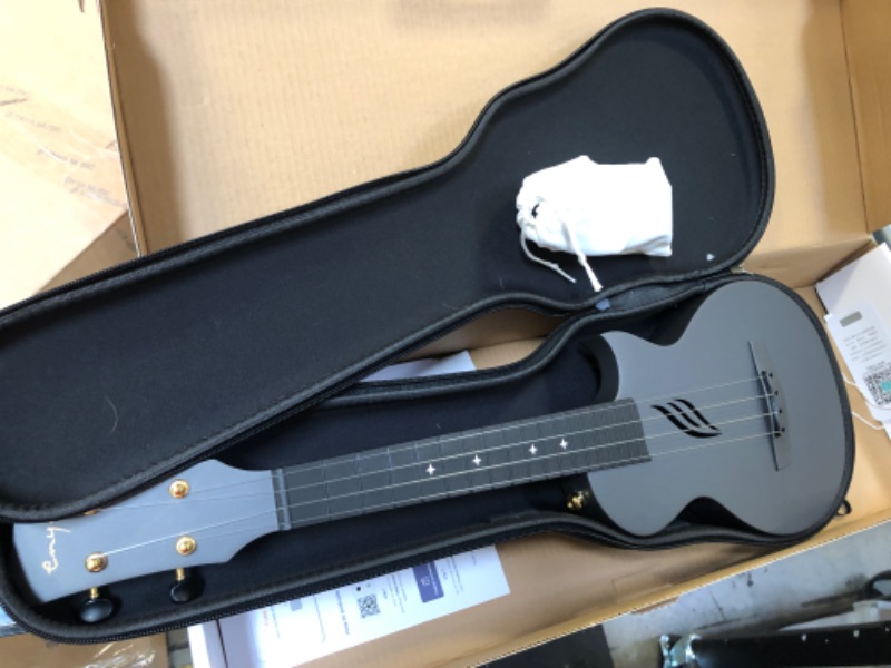 Photo 2 of Enya Concert Ukulele Nova U 23’’ Carbon Fiber Travel Ukulele with Beginner Kit includes online lessons, case, strap, capo and strings (Black)