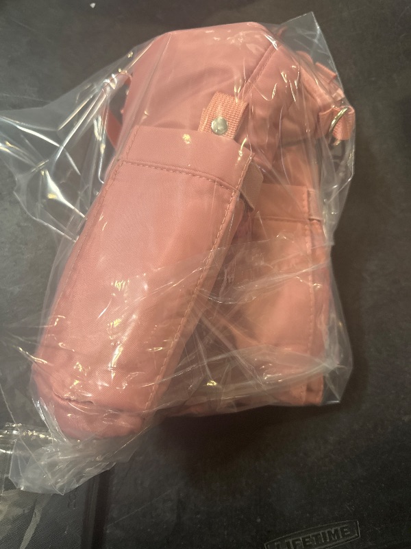 Photo 1 of pink lunchbox with extra strap for easy carrying 