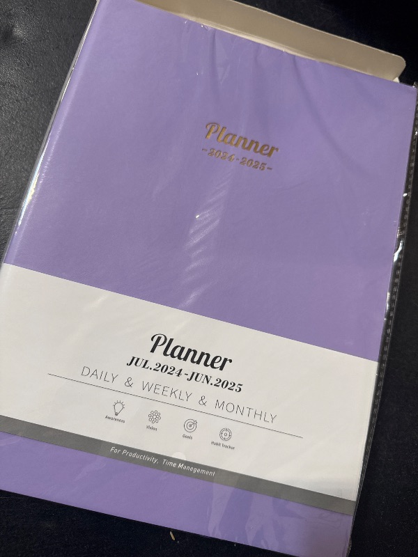 Photo 1 of purple planner july 24-june 2025 daily , weekly & monthly 