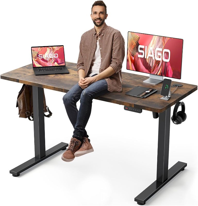 Photo 1 of SIAGO Electric Standing Desk Adjustable - 55 x 24 Inch Sit Stand up Desk with Cable Management - 3 Memory Preset Adjustable Height Desk Computer Home Office Desk