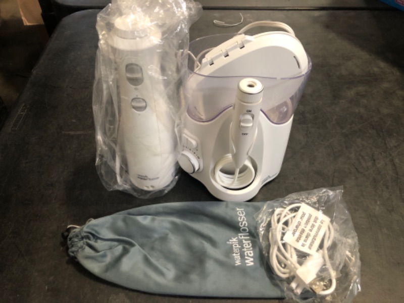 Photo 1 of Waterpik Ultra Plus and Cordless Pearl Water Flosser Combo Pack