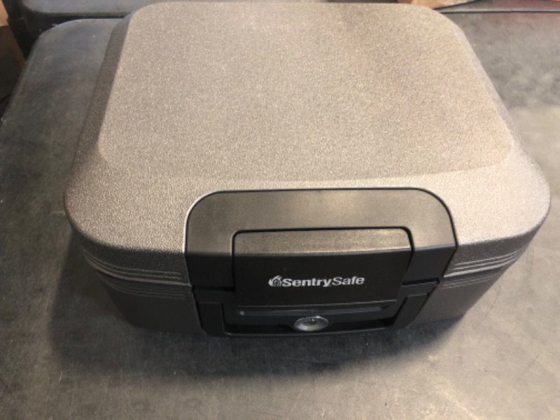 Photo 1 of SentrySafe Dark Gray Fireproof and Waterproof Safe with Key Lock, Chest Lock Box with Carrying Handle for Travel, 0.28 Cubic Feet, 6.6 x 15.4 x 14.3 Inches, CFW20201