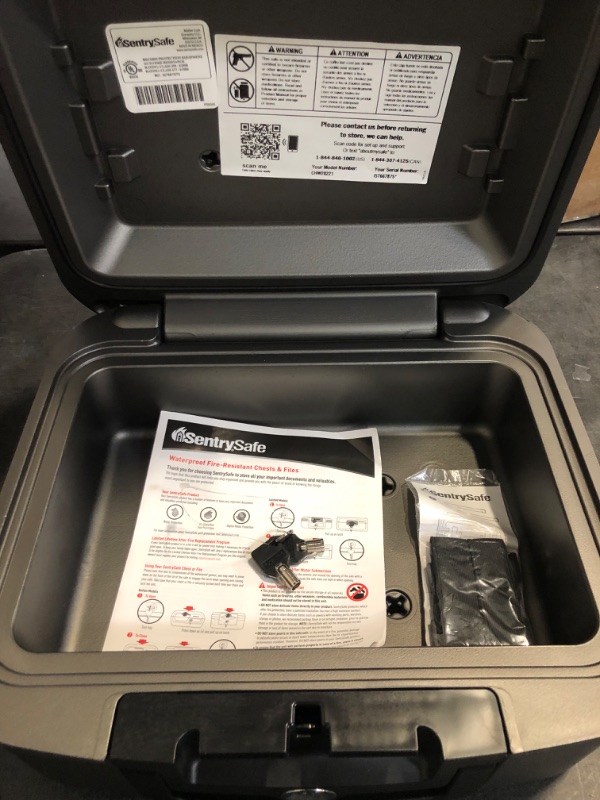 Photo 1 of SentrySafe Dark Gray Fireproof and Waterproof Safe with Key Lock, Chest Lock Box with Carrying Handle for Travel, 0.28 Cubic Feet, 6.6 x 15.4 x 14.3 Inches, CFW20201