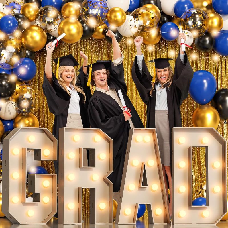 Photo 1 of 2024 Graduation Decorations, 78PCS Blue and Gold Graduation Party Supplies with 2FT Mosaic Marquee Light Up Letters Sign “GRAD”, Balloons Garland Arch Kit, Led String Lights, Foil Curtains Backdrop
