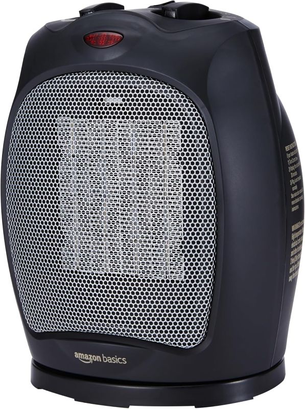 Photo 1 of Amazon Basics 1500W Oscillating Ceramic Indoor Space Heater with Adjustable Thermostat, Black, 7.52"D x 6.34"W x 9.45"H
