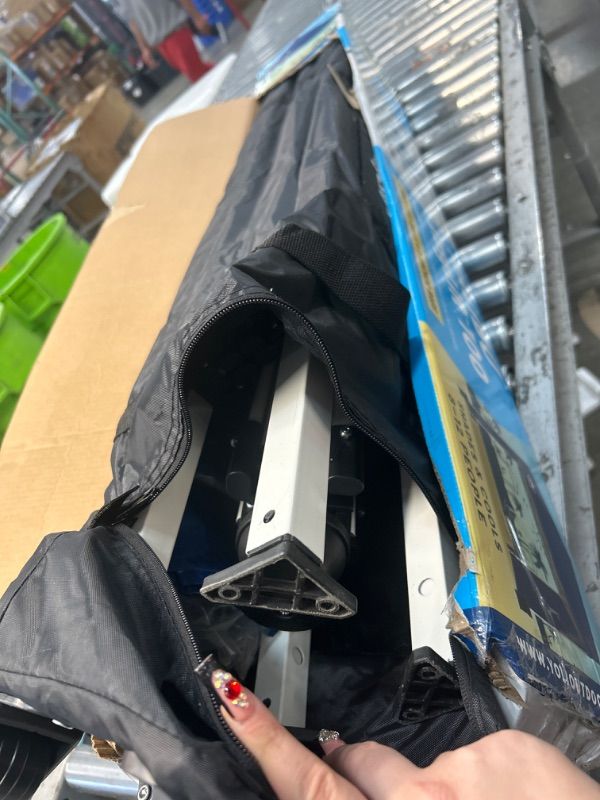 Photo 1 of ****UNKNOWN IF MISSING PARTS *** Yoli Westport 64 10' x 10' Slant Leg Instant Canopy
