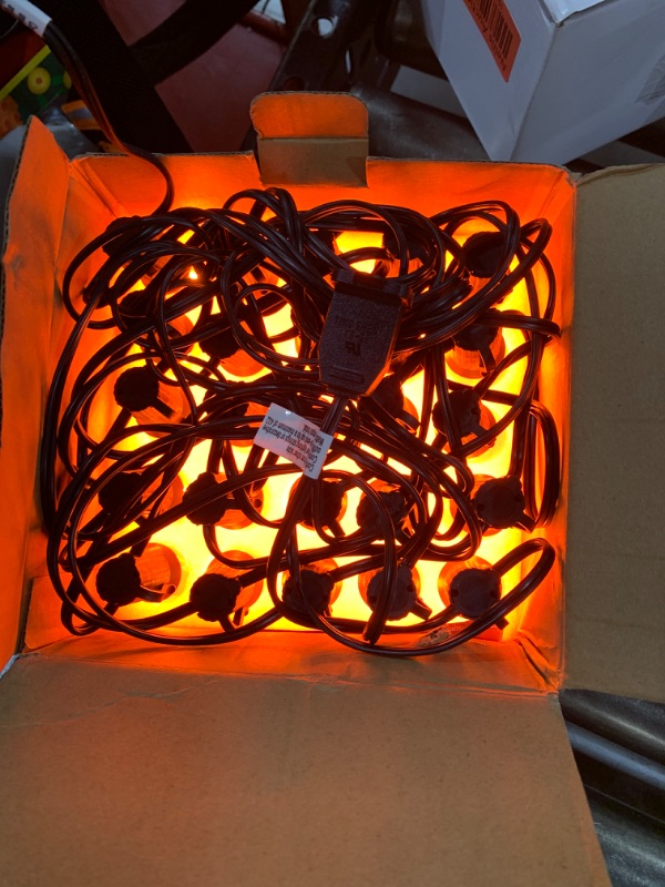 Photo 2 of C9 Orange Halloween String Lights, 25Ft Christmas Outdoor String Lights with 26 Clear Orange Bulbs(1 Spare), Hanging Patio Lights for Outdoor Halloween Christmas Roofline Party Decoration- Black Wire