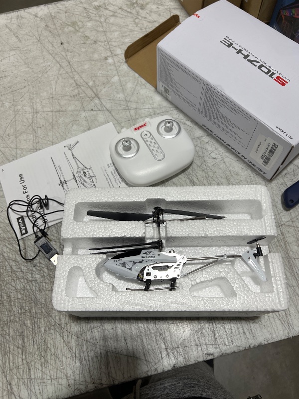 Photo 1 of SYMA RC Helicopter,Remote Control Helicopter for Kids Airplanes with Altitude Hold, 3.5 Channel, Gyro Stabilizer, Remoter Aircraft Helicopter Toys for 8-12 Boys Girls as a Gift Indoor White