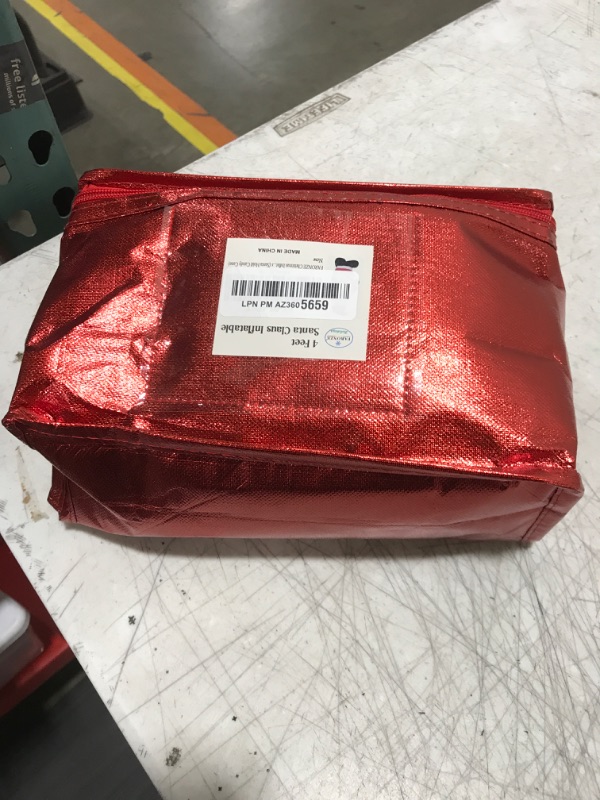 Photo 1 of FARONZE Christmas Inflatable Santa Claus Holds Candy Cane Lighted Indoor & Outdoor Christmas Yard Lawn Blow-Up Decoration with Built-in Fan and Anchor Ropes 4 Feet Tall (Santa Holds Candy Cane)