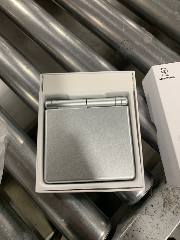 Photo 1 of RG35XXSP Retro Handheld Game Console, 3.5" IPS Fold Screen Linux OS 3300mAh Battery Video Game Player with 64+128G TF Card 10155 Games, Support 5G WiFi Bluetooth & HDMI TV Output