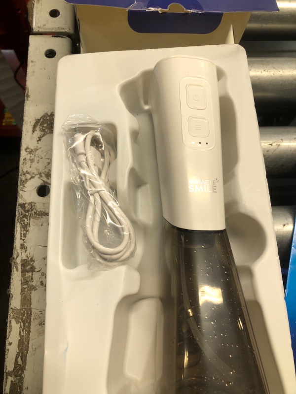 Photo 2 of ***ITEM TESTED FOR POWER, UNABLE TO TEST FURTHER***
Miracle Smile | 3 Adjustable Pressure Settings | Water Flosser That Gently Cleans and Flosses in 10 Seconds