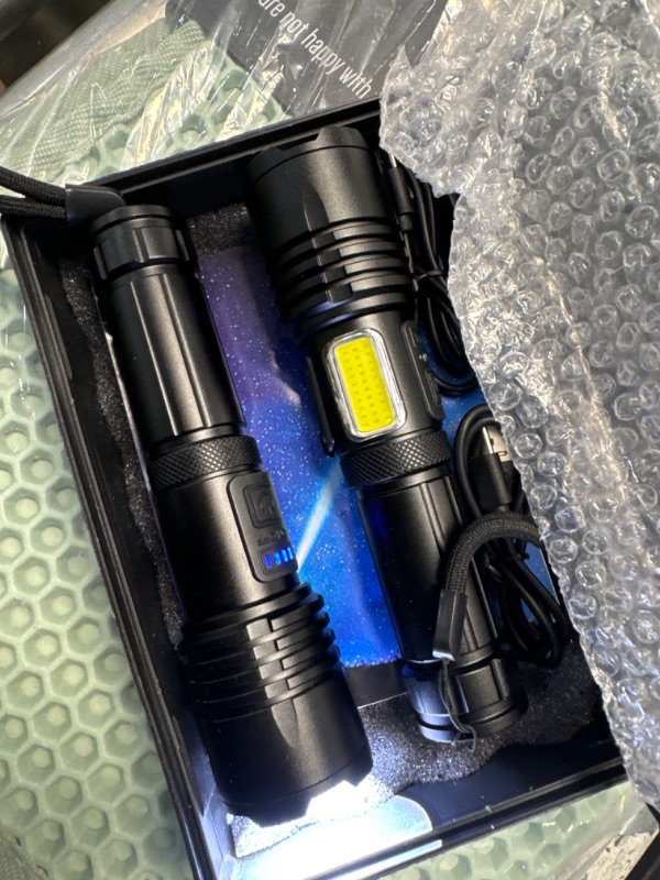 Photo 2 of *ONE OF THEM NEEDS CHARGE** BEFAMALI Rechargeable LED Flashlights High Lumens, 900,000 Lumens Super Bright Flashlight with 7 Modes & Waterproof, Handheld Powerful Flashlights for Camping, Emergencies, Home (2 Pack)