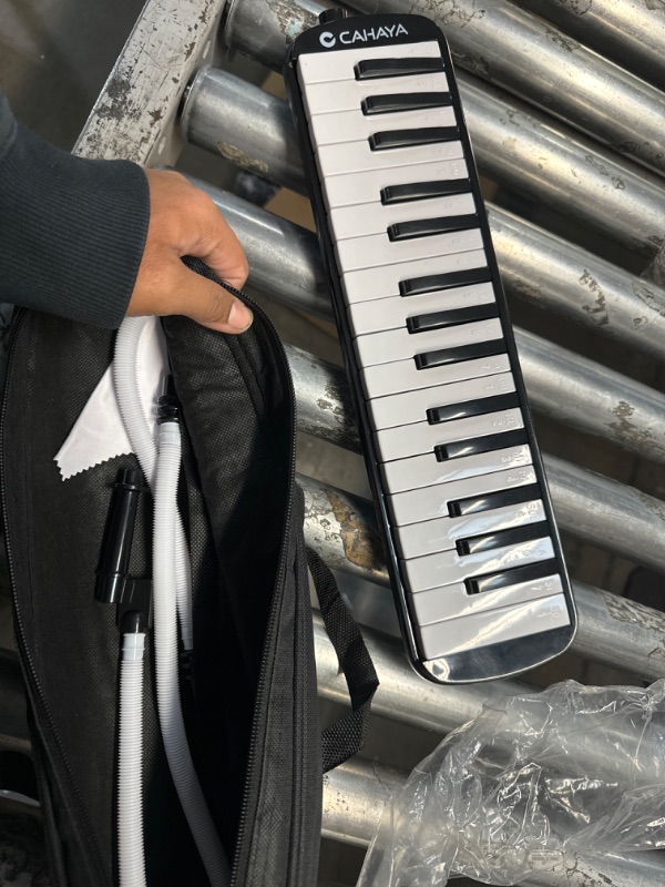 Photo 2 of *STOCK PHOTO JUST FOR REFERENCE** Melodica for Kids 32 Keys Melodica Instrument Air Piano Keyboard with 1 Long Tube, 1 Short Mouthpiece, 1 Bag for Beginners Students, Musical Gift for Boys & Girls (BLACK)
