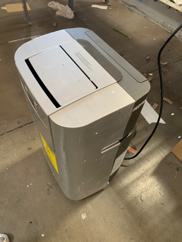 Photo 3 of ***USED - DAMAGED - SEE COMMENTS***
7,000 BTU Portable Air Conditioner Cools 400 Sq. Ft. with Heater, Dehumidifier, Remote, Filter in Silver