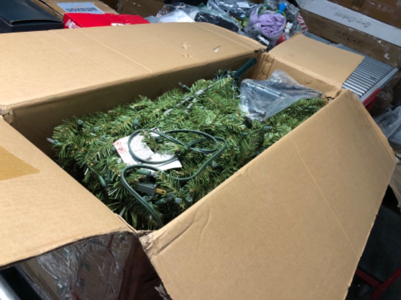 Photo 1 of National Tree Company Pre-Lit Artificial Full Christmas Tree, Green, Dunhill Fir, White Lights, Includes Stand, 6 Feet