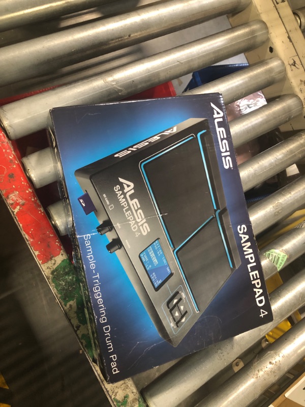 Photo 1 of Alesis Sample Pad 4 | Compact Percussion and Sample Triggering Instrument with 4 Velocity Sensitive Pads, 25 Drum Sounds and SD/SDHC Card Slot,Black