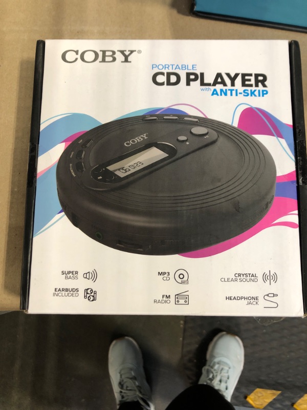 Photo 1 of COBY Portable CD Player with Earbuds, FM Radio & MP3 | Skip Protection, Lightweight & Shockproof Music Compact Disc Player | Portable Discman Perfect for Home Car and Travel