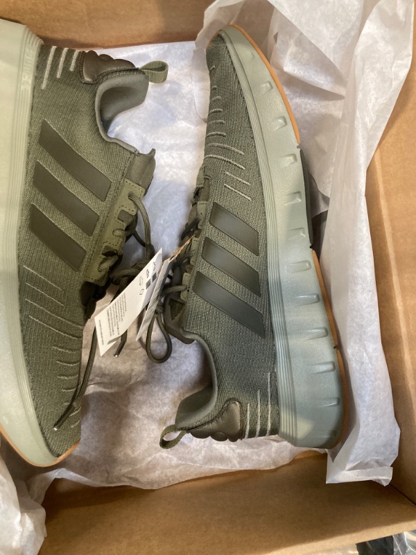 Photo 3 of adidas Men's Swift Run 23 Sneaker, Olive Strata/Shadow Olive/Gum, 13