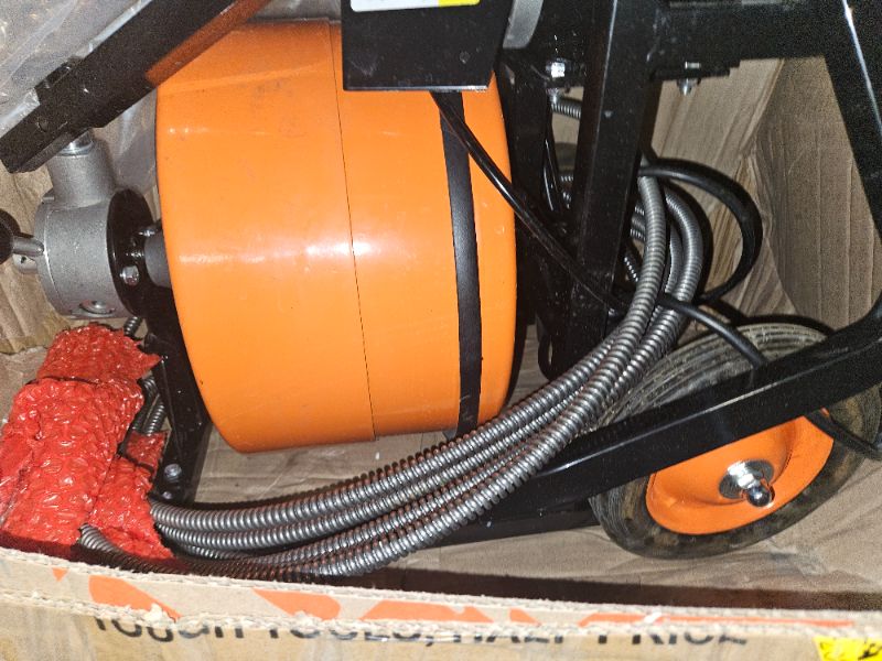 Photo 2 of **USED/UNABLE TO TEST**
VEVOR Drain Cleaner Machine 100FT x 1/2Inch Auto Feed Sewer Snake Auger with 4 Cutter Air-activated Foot Switch for 2" to 4" Pipes, Orange, Black