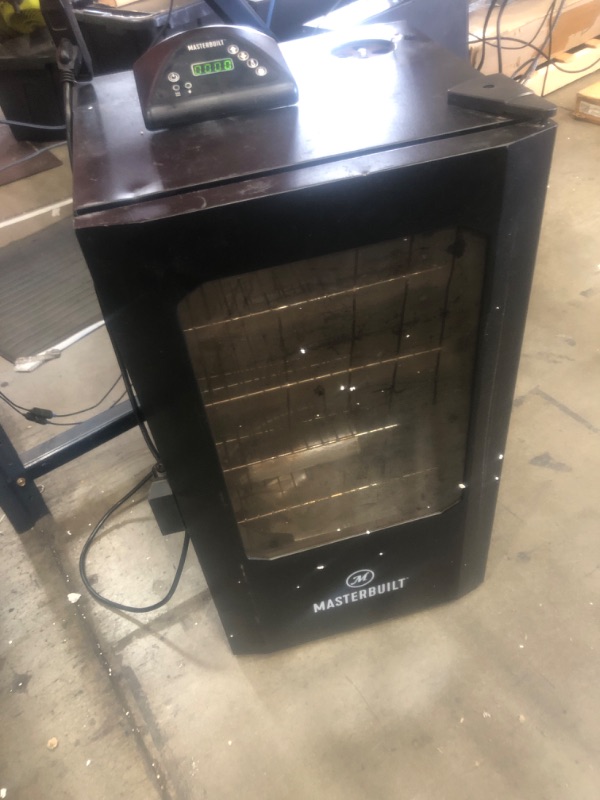 Photo 3 of **Dirty Used See Notes* Masterbuilt® 30-inch Digital Electric Vertical BBQ Smoker with Leg Kit, Side Wood Chip Loader and 710 Cooking Square Inches in Black, Model MB20070421 30" Smoker w/ Window & Legs