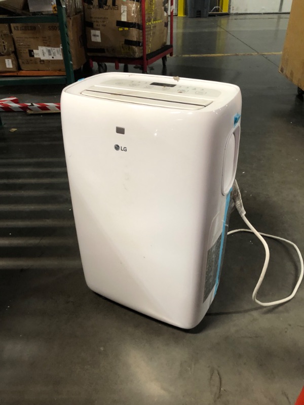 Photo 10 of ***USED - DIRTY - MISSING PARTS - SEE COMMENTS***
LG 6,000 BTU Portable Air Conditioner, 115V, Cools 250 Sq.Ft. (10' x 25' Room Size), Portable Air Conditioner for Home with Quiet Operation, LCD Remote Control, and Window Installation Kit, White