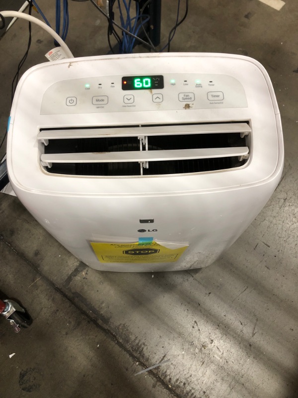 Photo 12 of ***USED - DIRTY - MISSING PARTS - SEE COMMENTS***
LG 6,000 BTU Portable Air Conditioner, 115V, Cools 250 Sq.Ft. (10' x 25' Room Size), Portable Air Conditioner for Home with Quiet Operation, LCD Remote Control, and Window Installation Kit, White