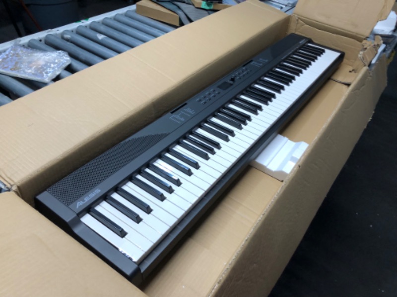 Photo 6 of ***USED - POWERS ON - UNABLE TO TEST FURTHER***
Alesis 88 Key Keyboard Piano with 480 Sounds, Speakers, USB MIDI, Carry-Bag, Stand, Headphones, Pedal and Piano Lessons for Beginners