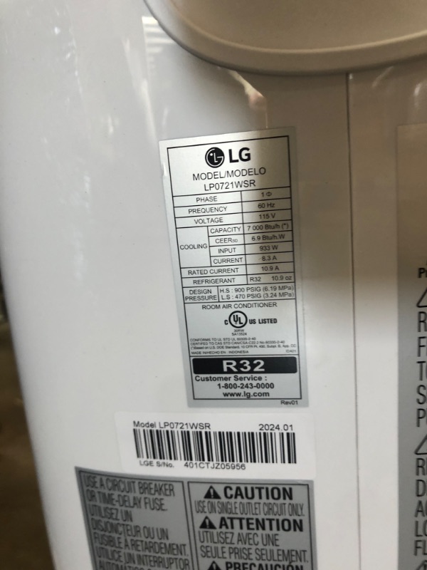 Photo 4 of * SEE NOTES UNIT MAKES NOISES* * LG 7,000 BTU Portable Air Conditioner, 115V, Cools 300 Sq.Ft. (12' x 25' Room Size), Portable Air Conditioner for Home with Quiet Operation, LCD Remote Control, and Window Installation Kit, White Up to 350 Sq. Ft. Cool Onl