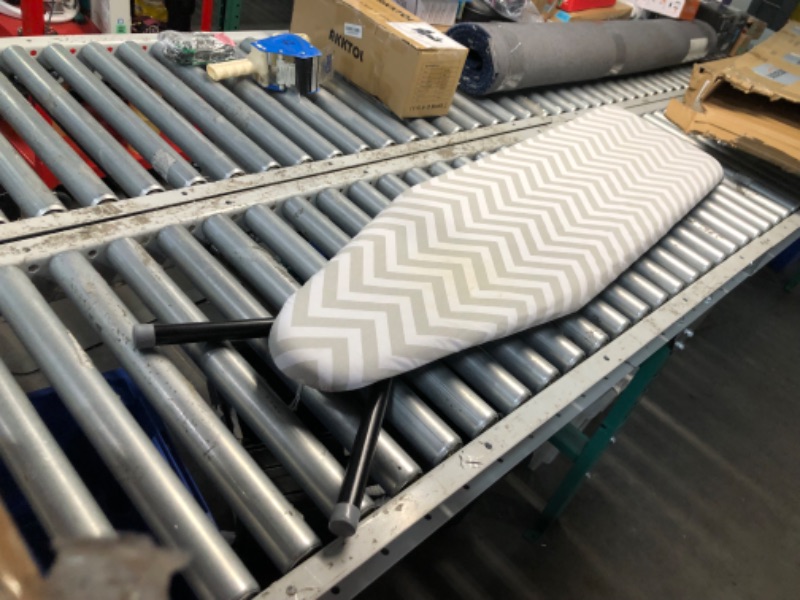 Photo 7 of ***USED - STAINED - SEE PICTURES***
Amazon Basics Full-Size Ironing Board - 4-Leg Fold-Up, Chevron Removable Cover, 60"L x 14"W x 38"H