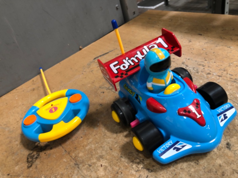 Photo 1 of **REQUIRES BATTERIES*.
Toddler race car 